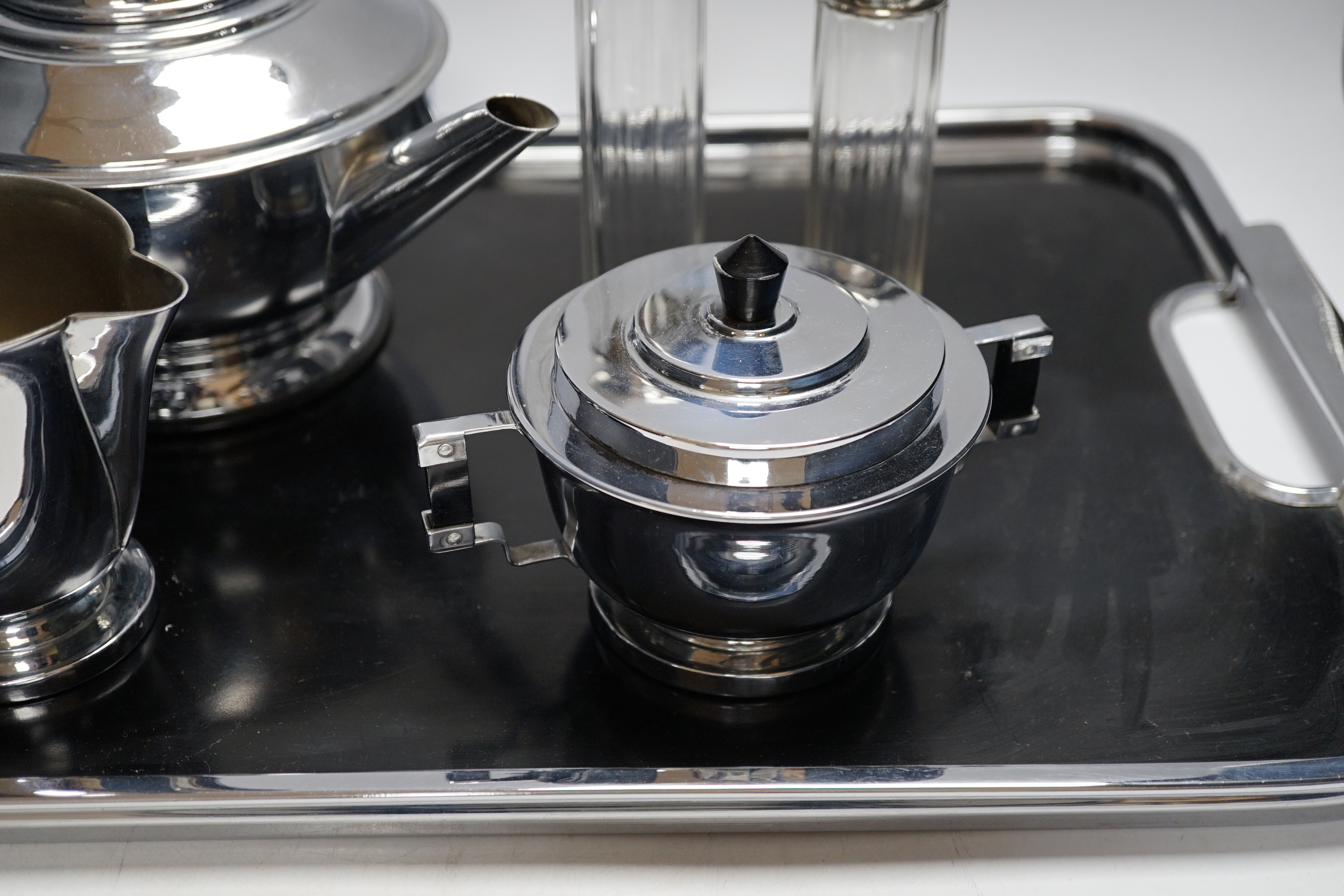 An Art Deco style plated teaset and tray and two silver jars